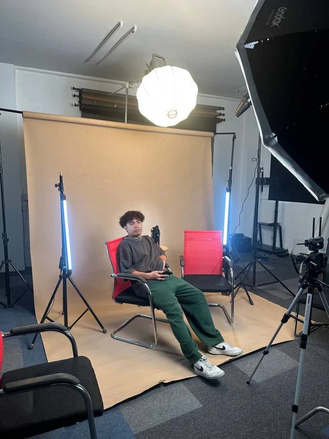 A portrait shoot with lighting and camera equipment at the Conex studio
